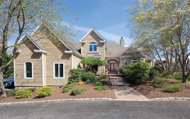 115 Highland Rd, Southampton, NY 11968 - traditional-style house with a chimney