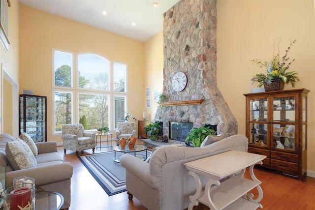 115 Highland Rd, Southampton, NY 11968 - living area with a towering ceiling, wood finished floors, a fireplace, and recessed lighting