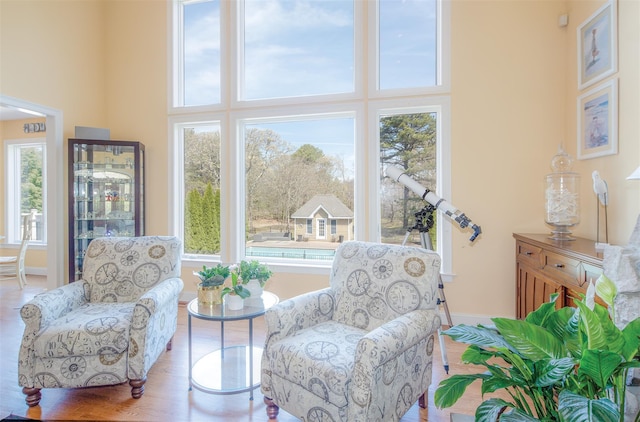 115 Highland Rd, Southampton, NY 11968 - sitting room featuring a towering ceiling and wood finished floors