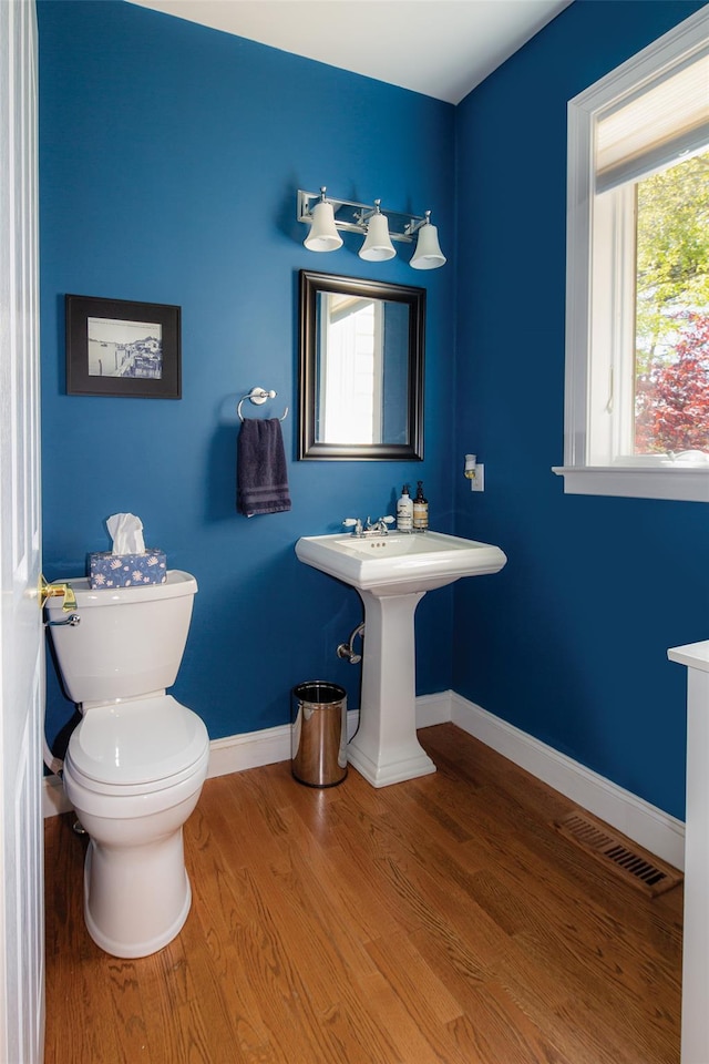 115 Highland Rd, Southampton, NY 11968 - half bath with wood finished floors and toilet