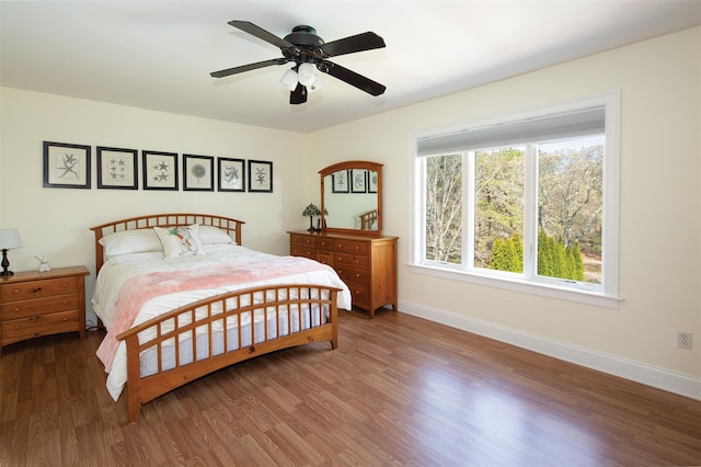 115 Highland Rd, Southampton, NY 11968 - bedroom with wood finished floors and a ceiling fan