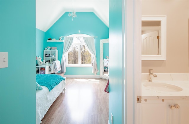 115 Highland Rd, Southampton, NY 11968 - bedroom with wood finished floors and vaulted ceiling
