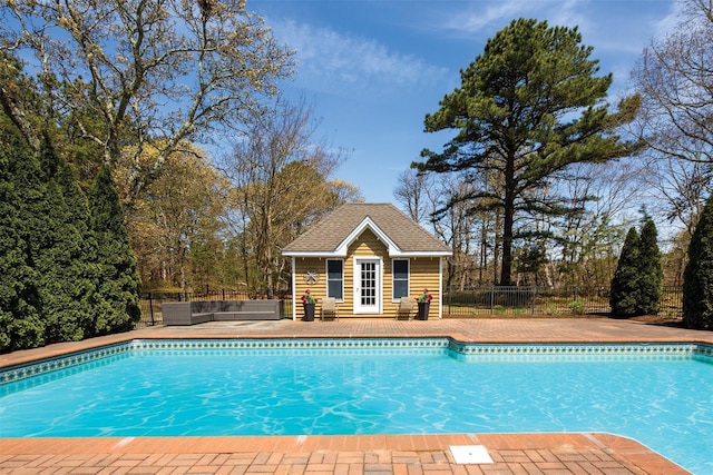 115 Highland Rd, Southampton, NY 11968 - view of swimming pool featuring an exterior structure, an outbuilding, and a patio