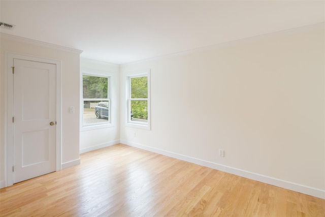 20 Oak Grove Rd, Southampton, NY 11968 - empty room with light wood finished floors and crown molding