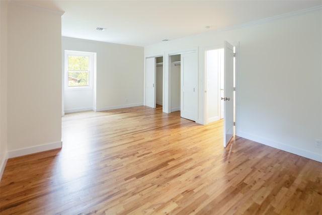 20 Oak Grove Rd, Southampton, NY 11968 - unfurnished bedroom with light wood-type flooring and crown molding