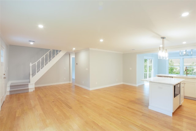 20 Oak Grove Rd, Southampton, NY 11968 - kitchen with a center island, light countertops, crown molding, recessed lighting, and pendant lighting