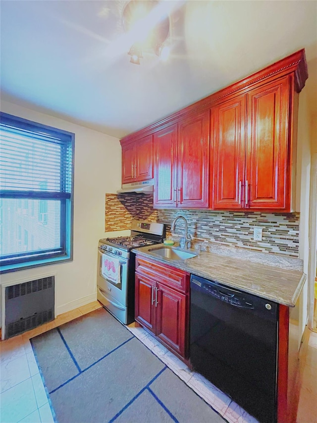 84-31 Van Wyck Expy Unit 5F, Briarwood, NY 11435 - kitchen with radiator, stainless steel gas stove, dishwasher, under cabinet range hood, and backsplash
