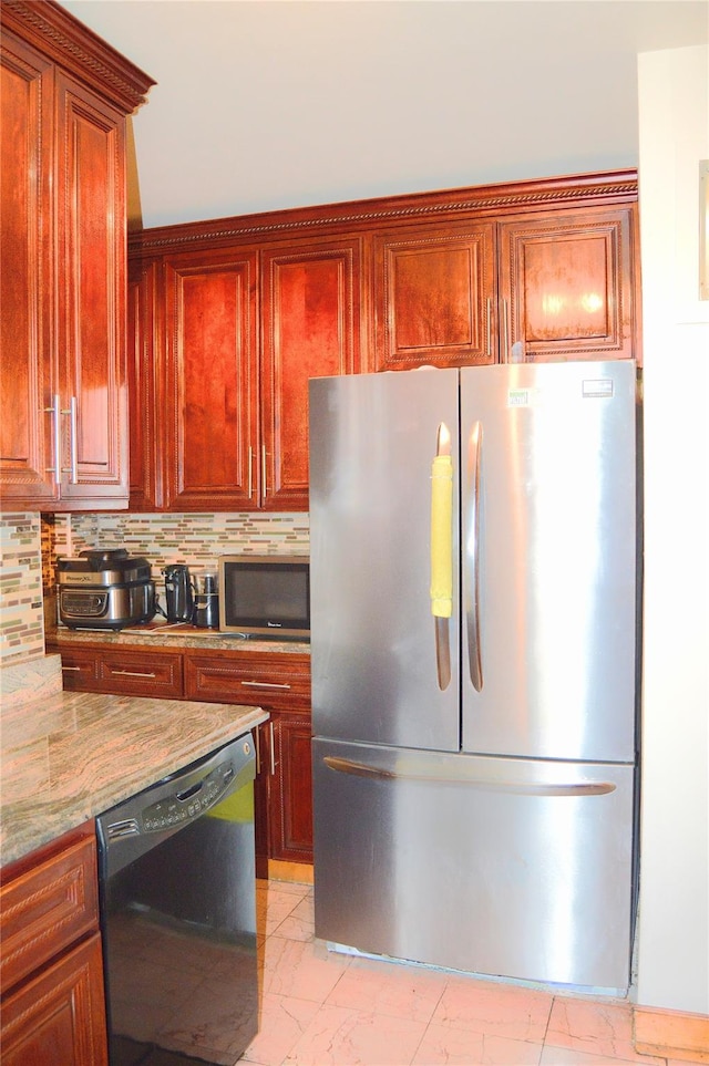84-31 Van Wyck Expy Unit 5F, Briarwood, NY 11435 - kitchen with appliances with stainless steel finishes, decorative backsplash, light marble finish flooring, light stone countertops, and dark brown cabinets