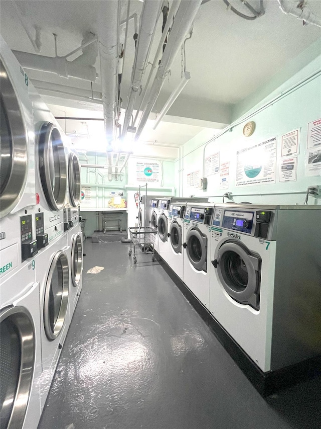 84-31 Van Wyck Expy Unit 5F, Briarwood, NY 11435 - shared laundry featuring stacked washing machine and dryer, a garage, and washing machine and dryer