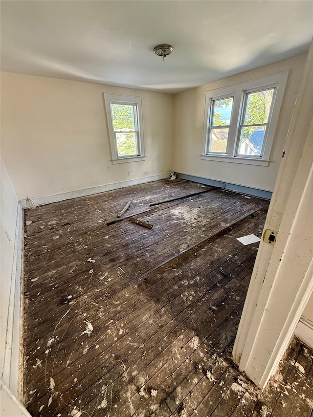 65 Mount Joy Ave, Freeport, NY 11520 - spare room with hardwood / wood-style flooring and baseboards