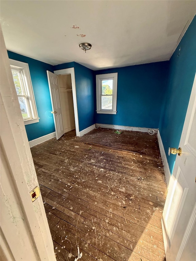 65 Mount Joy Ave, Freeport, NY 11520 - unfurnished bedroom with wood-type flooring and a closet