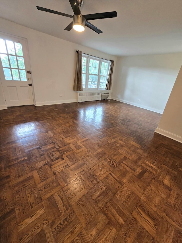 151-35 84th St Unit 1C, Howard Beach, NY 11414 - spare room with radiator heating unit and a ceiling fan