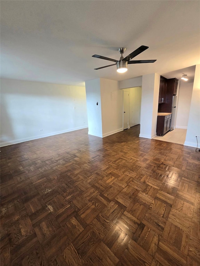 151-35 84th St Unit 1C, Howard Beach, NY 11414 - unfurnished living room featuring a ceiling fan and baseboards