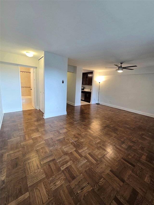 151-35 84th St Unit 1C, Howard Beach, NY 11414 - unfurnished living room with a ceiling fan and baseboards