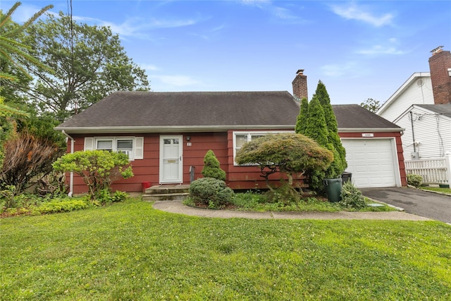11 Glenwood Rd, Glen Head, NY 11545 - view of front of property with driveway, a front yard, an attached garage, and a chimney