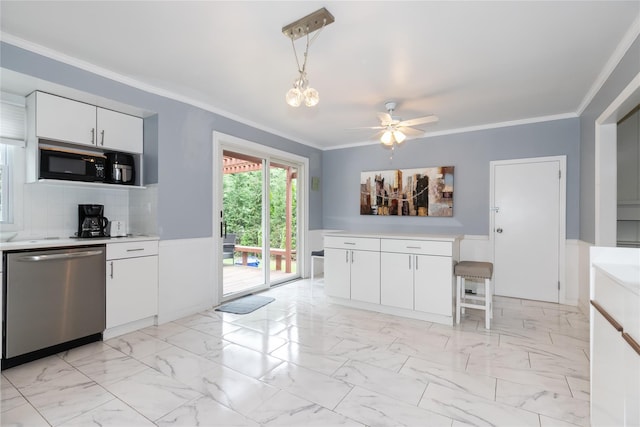 11 Glenwood Rd, Glen Head, NY 11545 - kitchen with dishwasher, black microwave, light countertops, white cabinets, and decorative light fixtures