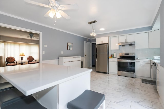11 Glenwood Rd, Glen Head, NY 11545 - kitchen featuring stainless steel appliances, under cabinet range hood, a ceiling fan, light marble finish floors, and white cabinetry