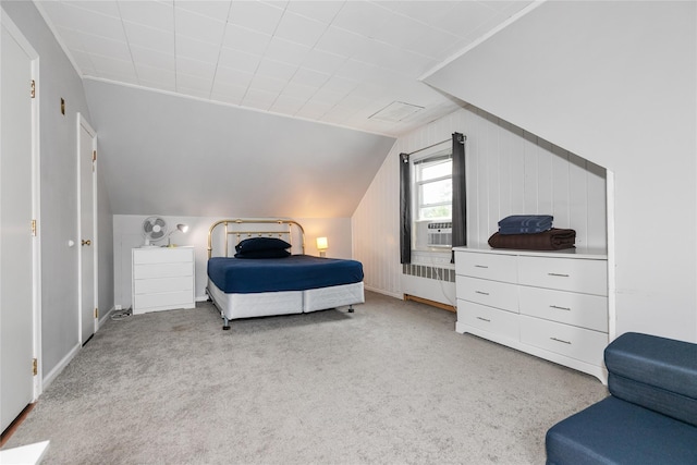 11 Glenwood Rd, Glen Head, NY 11545 - bedroom with radiator, lofted ceiling, light colored carpet, and cooling unit