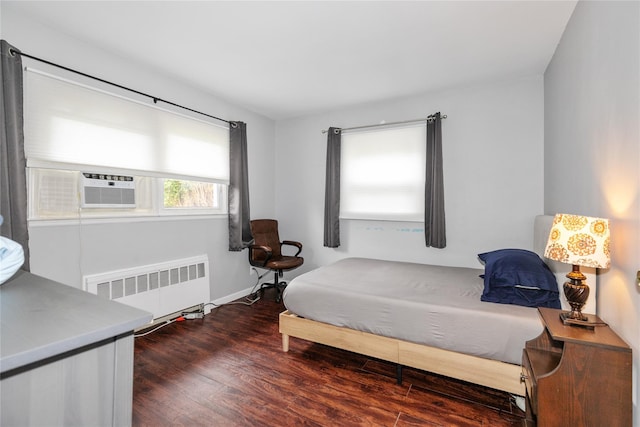 11 Glenwood Rd, Glen Head, NY 11545 - bedroom with radiator heating unit, wood finished floors, and cooling unit