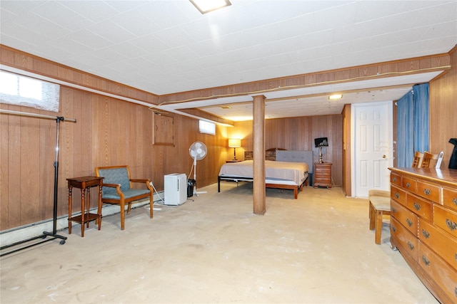 11 Glenwood Rd, Glen Head, NY 11545 - bedroom featuring wood walls and unfinished concrete flooring