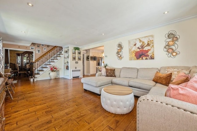 369 S 16th St, Lindenhurst, NY 11757 - living room with radiator, stairway, hardwood / wood-style floors, ornamental molding, and recessed lighting
