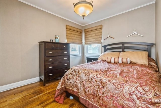 369 S 16th St, Lindenhurst, NY 11757 - bedroom with wood finished floors and crown molding