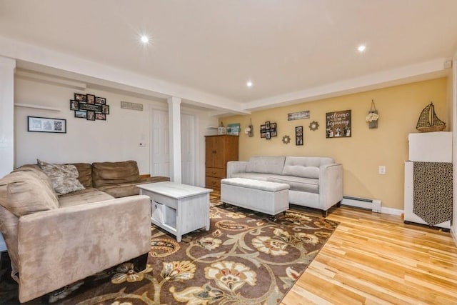 369 S 16th St, Lindenhurst, NY 11757 - living room featuring wood finished floors, a baseboard heating unit, and recessed lighting