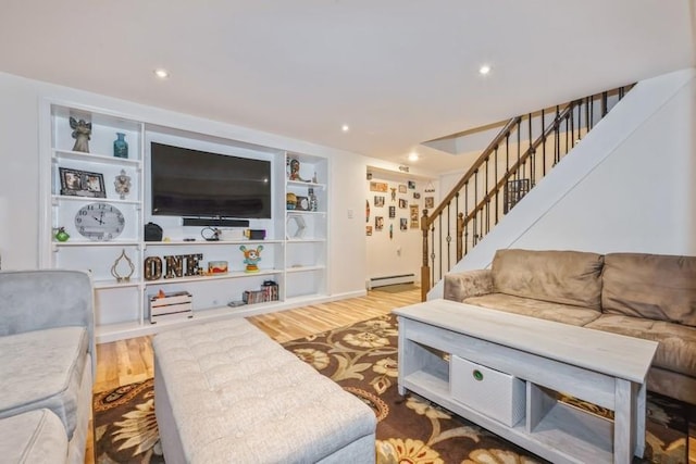 369 S 16th St, Lindenhurst, NY 11757 - living room with baseboard heating, stairway, wood finished floors, and recessed lighting