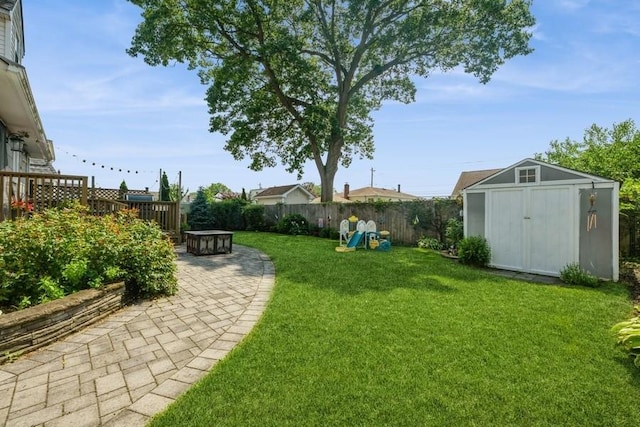 369 S 16th St, Lindenhurst, NY 11757 - view of yard featuring a shed and a patio area