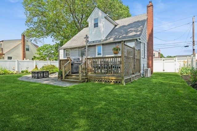 369 S 16th St, Lindenhurst, NY 11757 - rear view of property with a fenced backyard, a deck, a patio area, a chimney, and a shingled roof