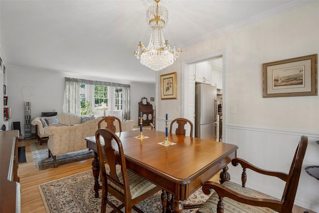 16 Ria Dr, White Plains, NY 10605 - dining room with a chandelier, light wood-style flooring, ornamental molding, and wainscoting