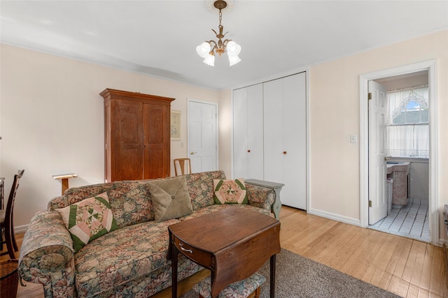 16 Ria Dr, White Plains, NY 10605 - living room with light wood-type flooring and a chandelier