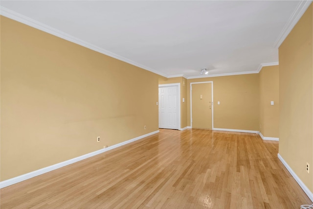 6 Birchwood Ct Unit 5N, Mineola, NY 11501 - spare room with light wood-style floors and crown molding