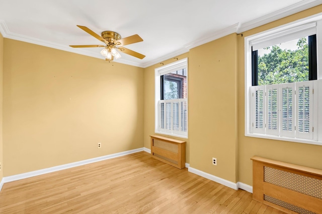 6 Birchwood Ct Unit 5N, Mineola, NY 11501 - unfurnished room with radiator heating unit, light wood-type flooring, crown molding, and a ceiling fan