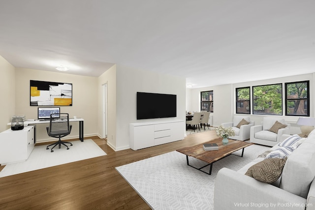 6 Birchwood Ct Unit 4G, Mineola, NY 11501 - living area featuring wood finished floors and a desk