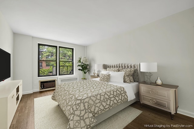 6 Birchwood Ct Unit 4G, Mineola, NY 11501 - bedroom with dark wood-style floors and a wall mounted air conditioner