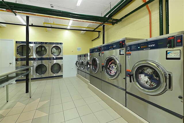 6 Birchwood Ct Unit 4G, Mineola, NY 11501 - shared laundry featuring stacked washer / dryer and washer and clothes dryer