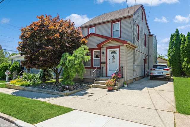 232 Broad St, Williston Park, NY 11596 - view of front of property with concrete driveway