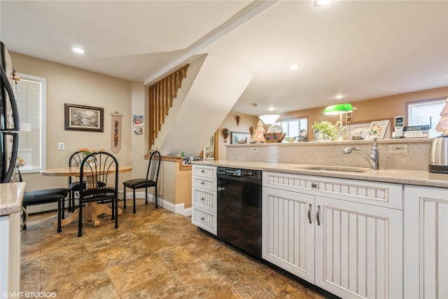 232 Broad St, Williston Park, NY 11596 - kitchen with dishwasher, healthy amount of natural light, white cabinets, and recessed lighting