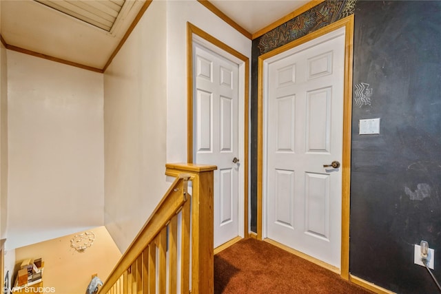 232 Broad St, Williston Park, NY 11596 - corridor with dark colored carpet, crown molding, and an upstairs landing