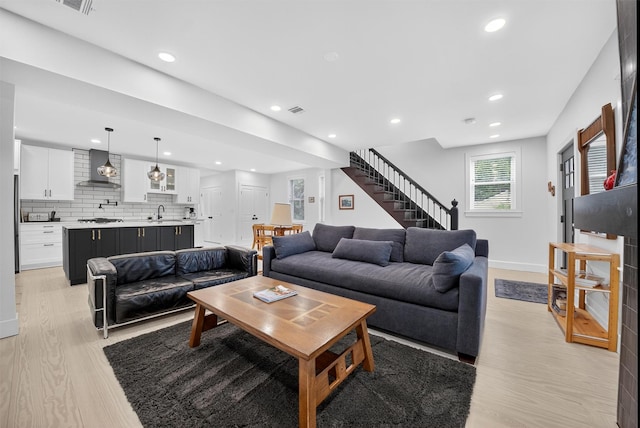 39 Frost Ln, Cornwall, NY 12518 - living area featuring light wood-style flooring, stairway, and recessed lighting