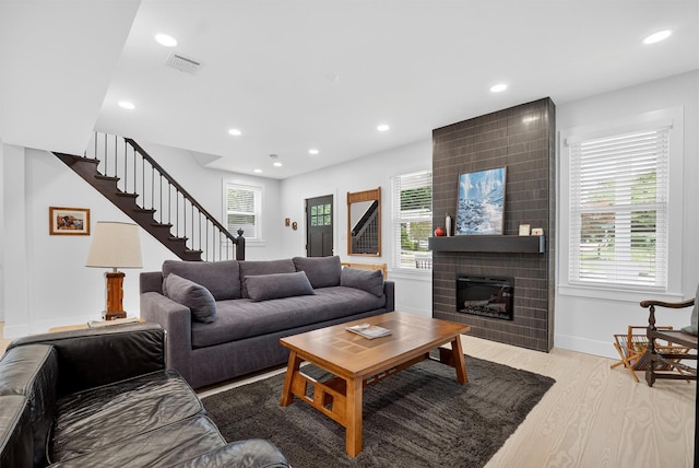 39 Frost Ln, Cornwall, NY 12518 - living room featuring stairs, recessed lighting, wood finished floors, and a large fireplace