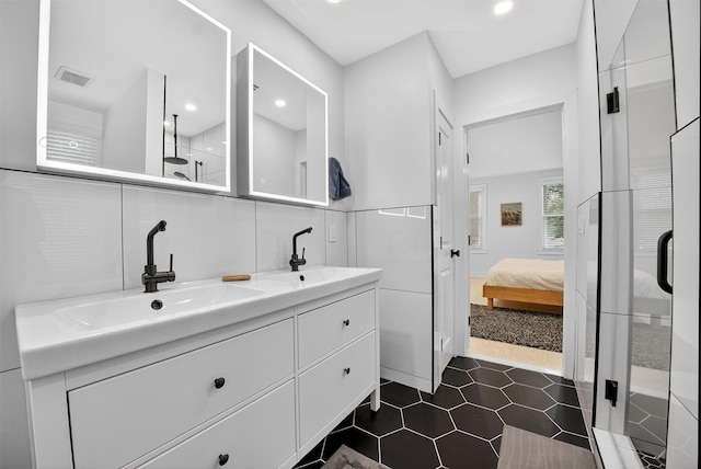 39 Frost Ln, Cornwall, NY 12518 - bathroom with a stall shower, double vanity, ensuite bath, tile patterned flooring, and recessed lighting