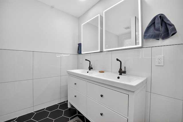 39 Frost Ln, Cornwall, NY 12518 - bathroom featuring tile walls, double vanity, and tile patterned flooring