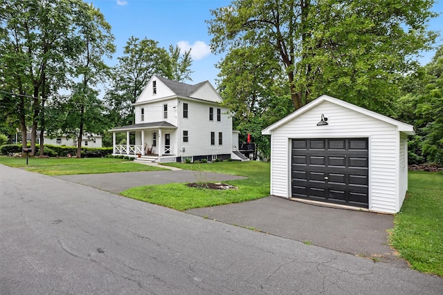 39 Frost Ln, Cornwall, NY 12518 - view of front of home featuring a garage, an outbuilding, covered porch, a front lawn, and driveway