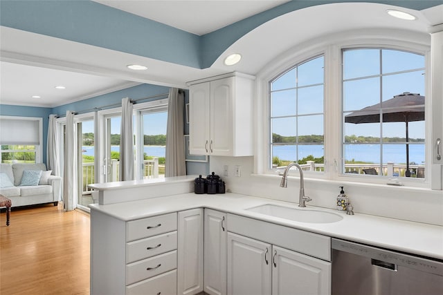 2055 Bay Shore Rd, Greenport, NY 11944 - kitchen featuring dishwasher, healthy amount of natural light, white cabinetry, a peninsula, and recessed lighting