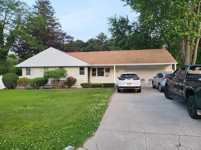 22 Prospect Ave, Brentwood, NY 11717 - view of front of property with a garage, concrete driveway, and a front lawn