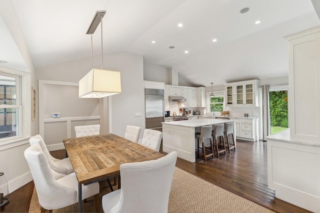 20 Stratton Sq, East Hampton, NY 11937 - dining area featuring dark wood finished floors, vaulted ceiling, and recessed lighting