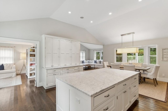 20 Stratton Sq, East Hampton, NY 11937 - kitchen featuring open floor plan, lofted ceiling, white cabinetry, dark wood finished floors, and light stone countertops