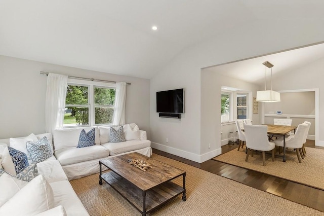 20 Stratton Sq, East Hampton, NY 11937 - living room with vaulted ceiling, wood finished floors, and healthy amount of natural light